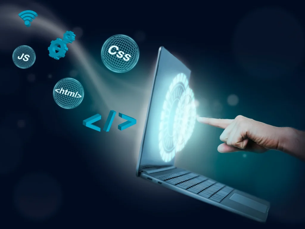 Imagem de um laptop com elementos de programação e tecnologias de criação de sites em 2025, incluindo códigos, CSS, HTML, JavaScript e inteligência artificial.